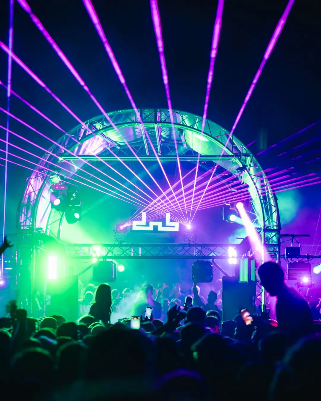 DnB Allstars 360 x 30Hz: Bristol: Purple laser fan over the lit arch stage and dnb logo, packed crowd