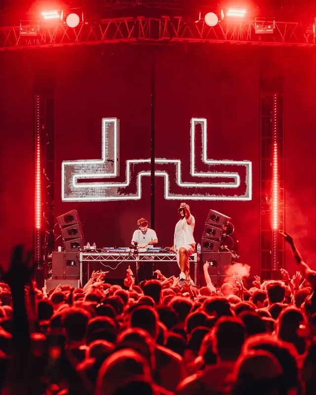 DnB Allstars: Auckland: Giant red dnb logo on stage above a packed crowd