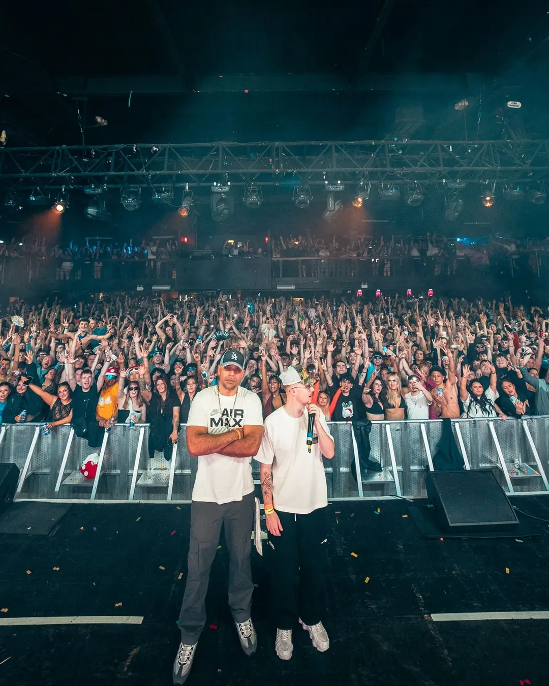 DnB Allstars NYE: Birmingham: Portrait version: stage-front pose with packed crowd and haze