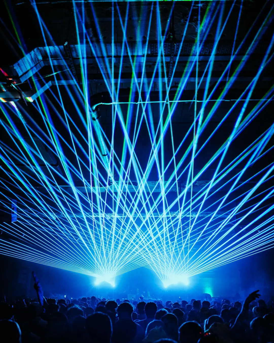 DnB Allstars NYE: Bristol 30Hz – The Final Underground Show: Symmetrical blue laser cage over the crowd, bold at card size