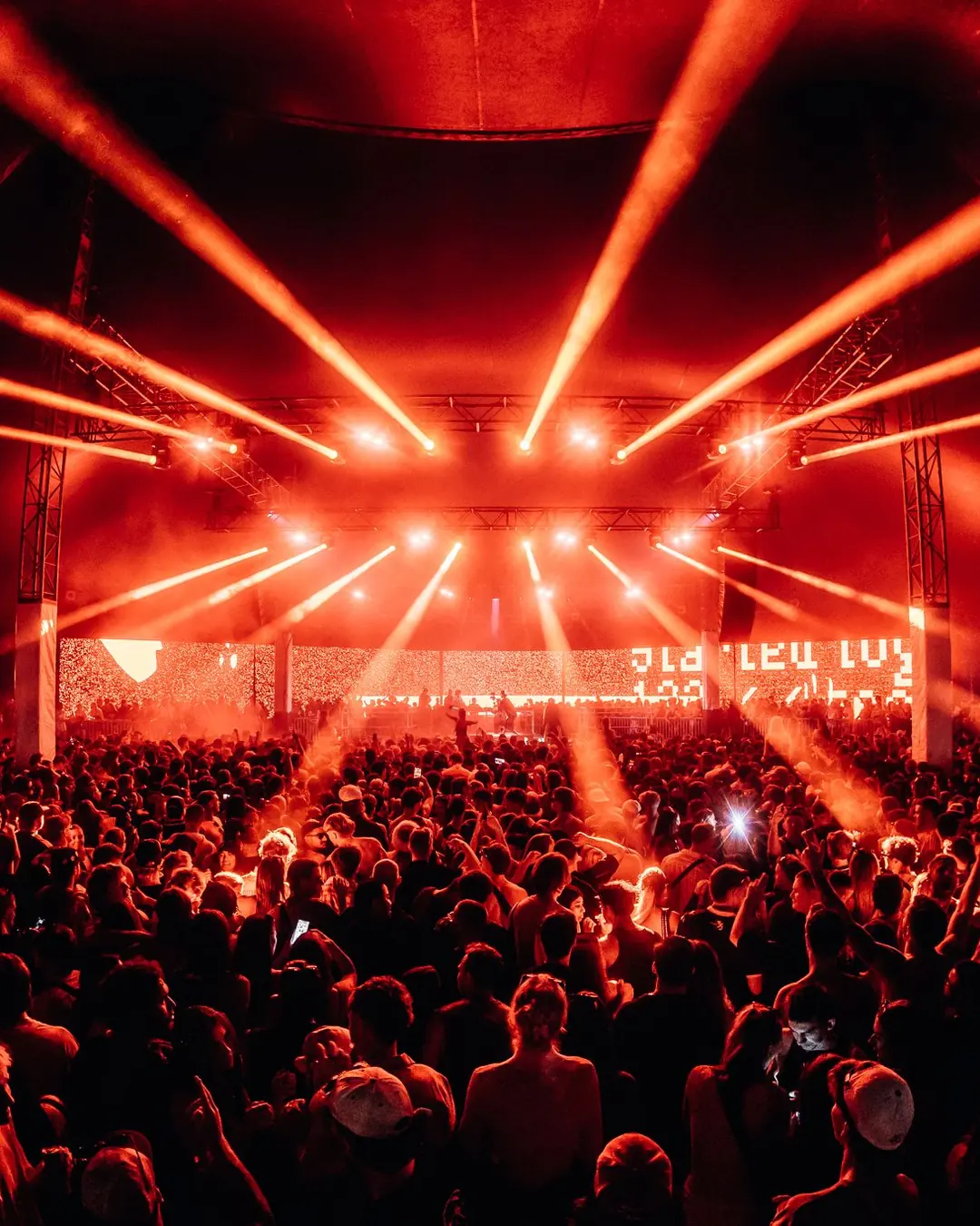 DnB Allstars: Perth: Red laser fan bursting from stage over packed tent