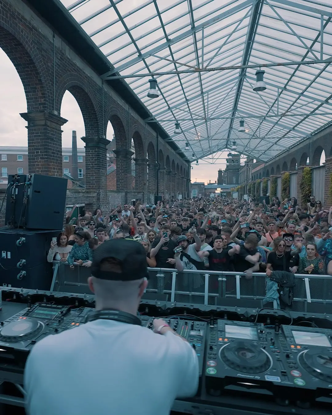 DnB Allstars Summer in the City: Chester: crowd filling the arched glass-roofed venue in daylight