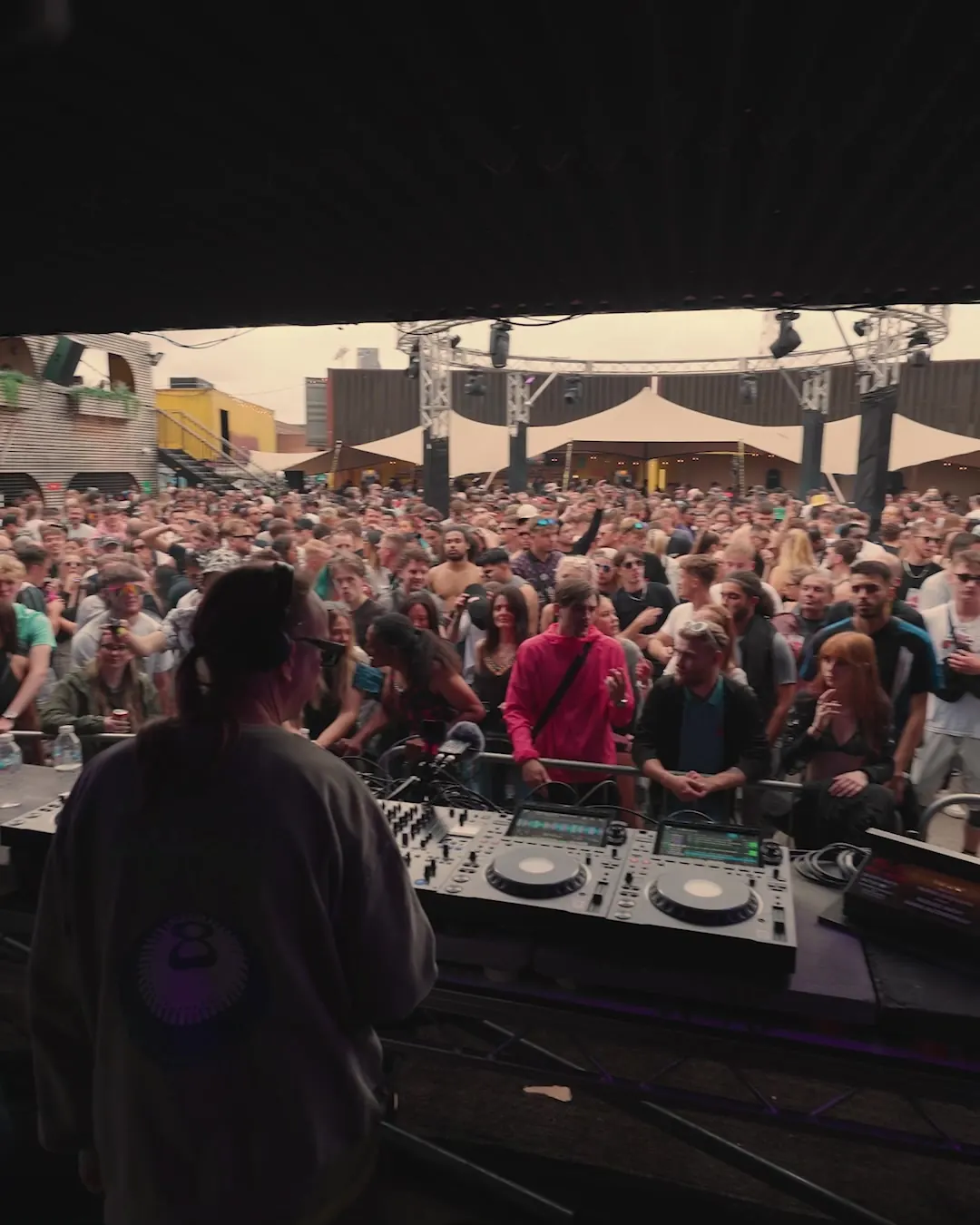 DnB Allstars Summer in the City: Censored: open-air crowd seen from behind the DJ