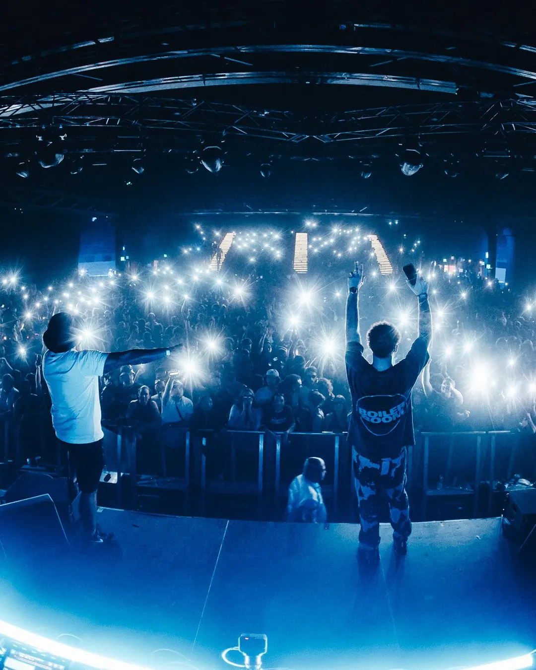 DnB Allstars: Sydney: Sea of phone lights seen from stage behind two artists