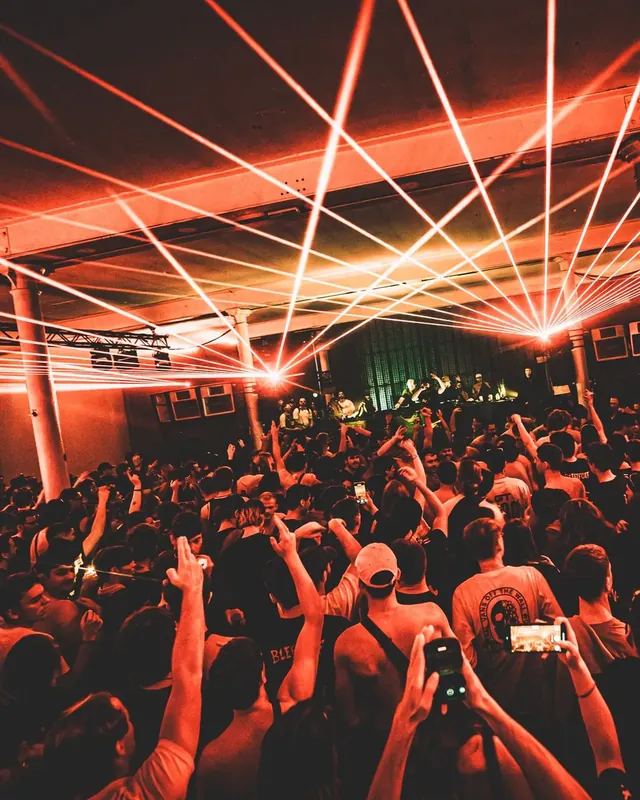 DnB Allstars x Bou’s House: Belgium: Red lasers radiating over packed crowd with hands raised